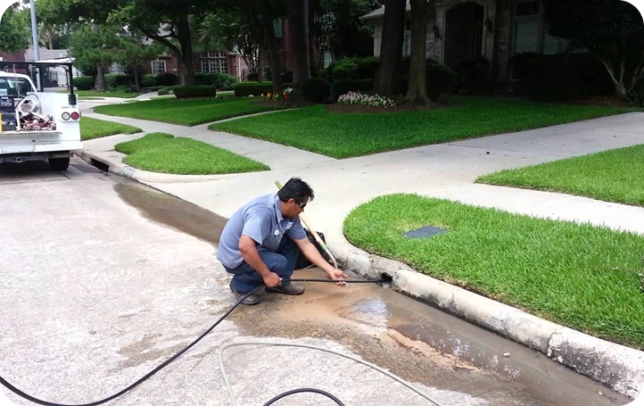 Plumber clearing a main-line drain clog in San Jose